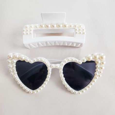 Elevate your glam quotient with our bling sunglasses. Adorned with dazzling crystals, rhinestones, or metallic accents, these stylish shades offer full UV protection, ensuring you make a sparkling statement while safeguarding your eyes from the sun's harmful rays.