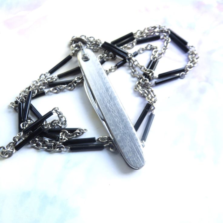 Curious about what a knife necklace is