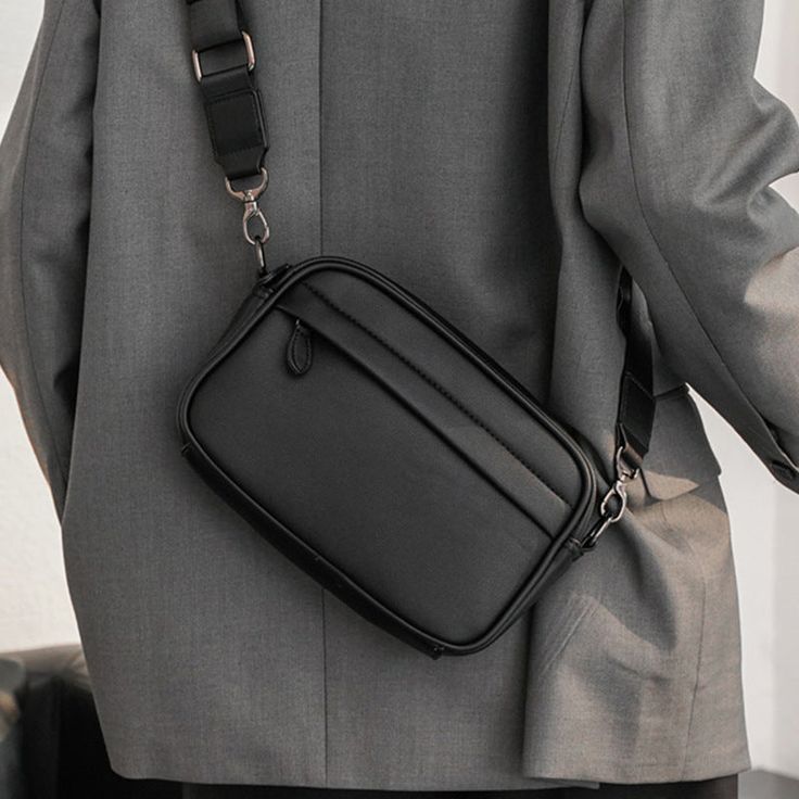 Explore why man bags are so popular.